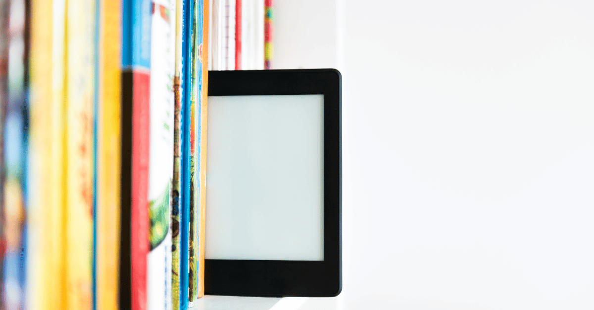 A tablet on the shelf with other colourful books representing advantages of ebooks