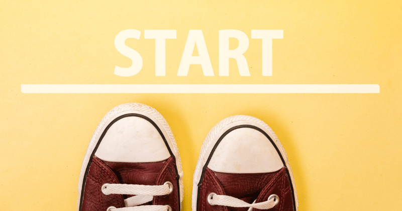 An image of the word "START" with a pair of trainers, taking the first step on a long journey, representing the beginning of a 30-day challenge.