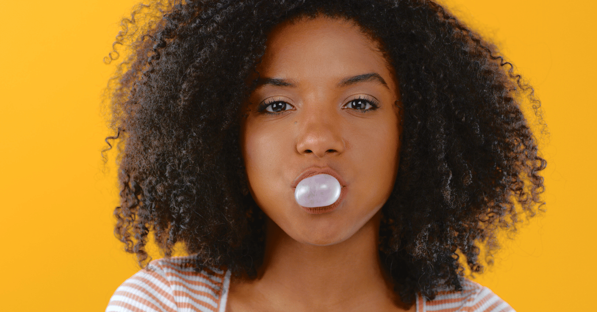 Woman blowing bubble gum, demonstrating how to deal with naysayers