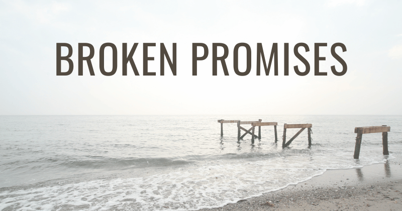 Wooden dock frame on sea shore missing the middle frame depicting the hidden price of broken promises